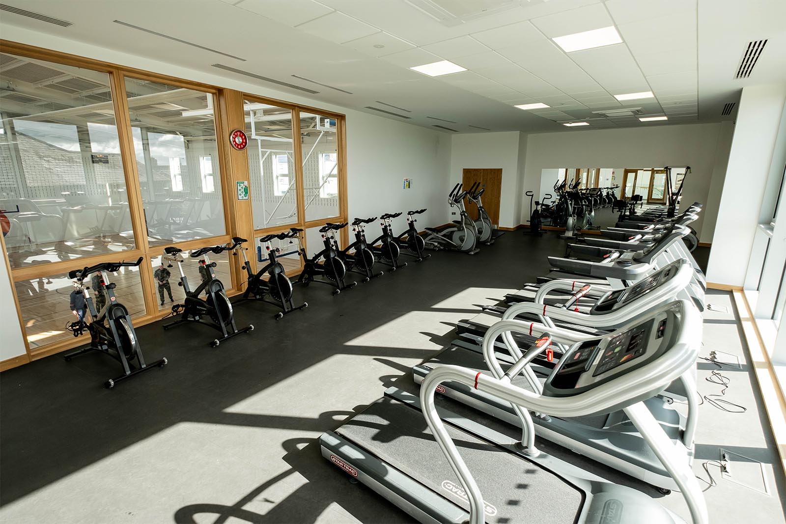 Interior of gym room showing treadmills